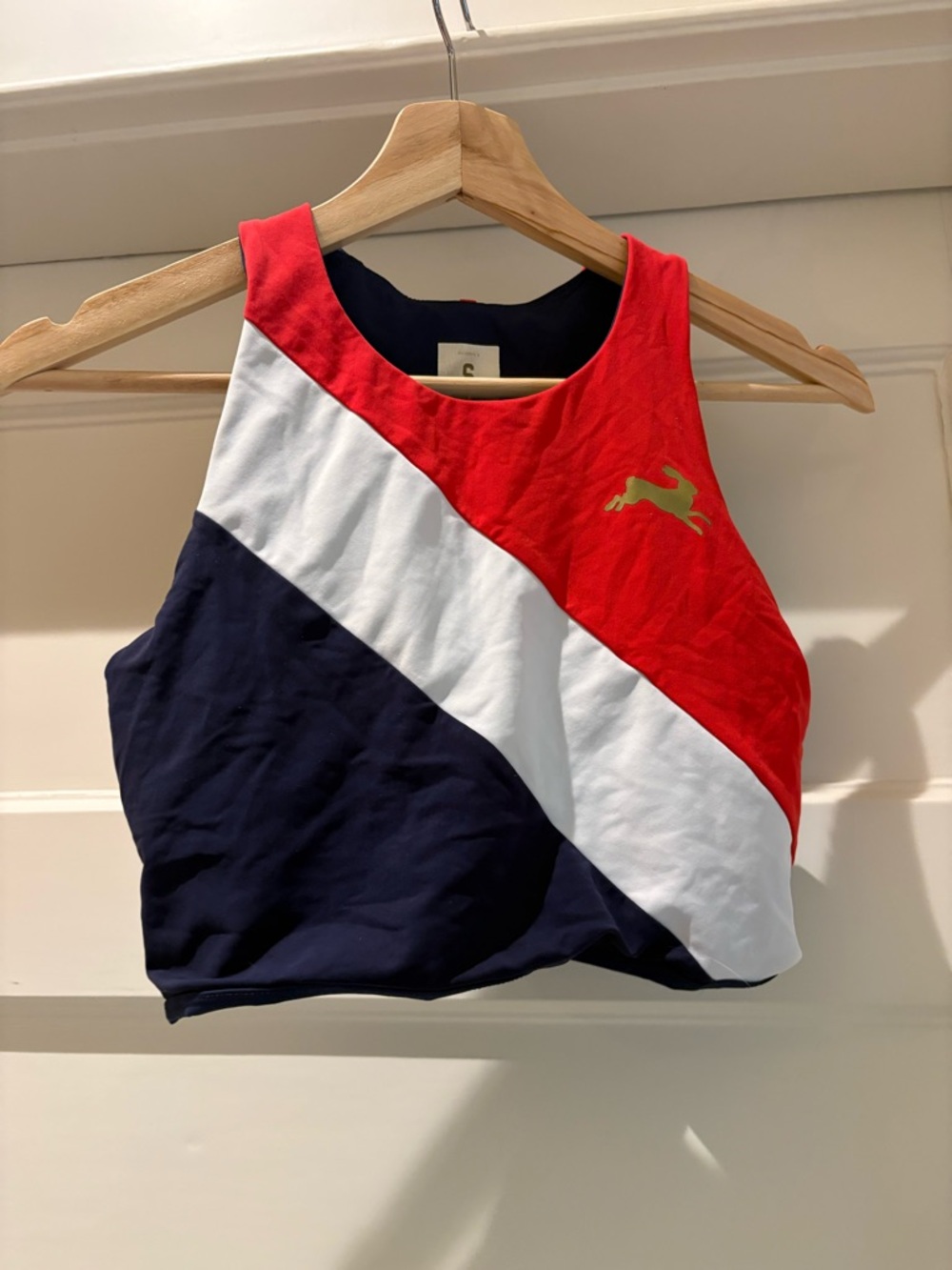 Tracksmith Bell Lap red, white and navy